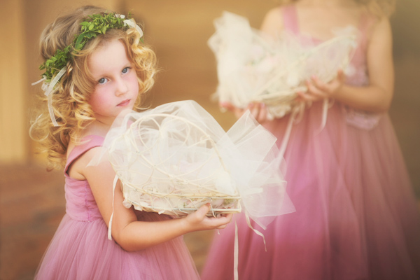 tulle and straw flower girl baskets and pink dresses, wedding photo by Natasha Du Preez Photography
